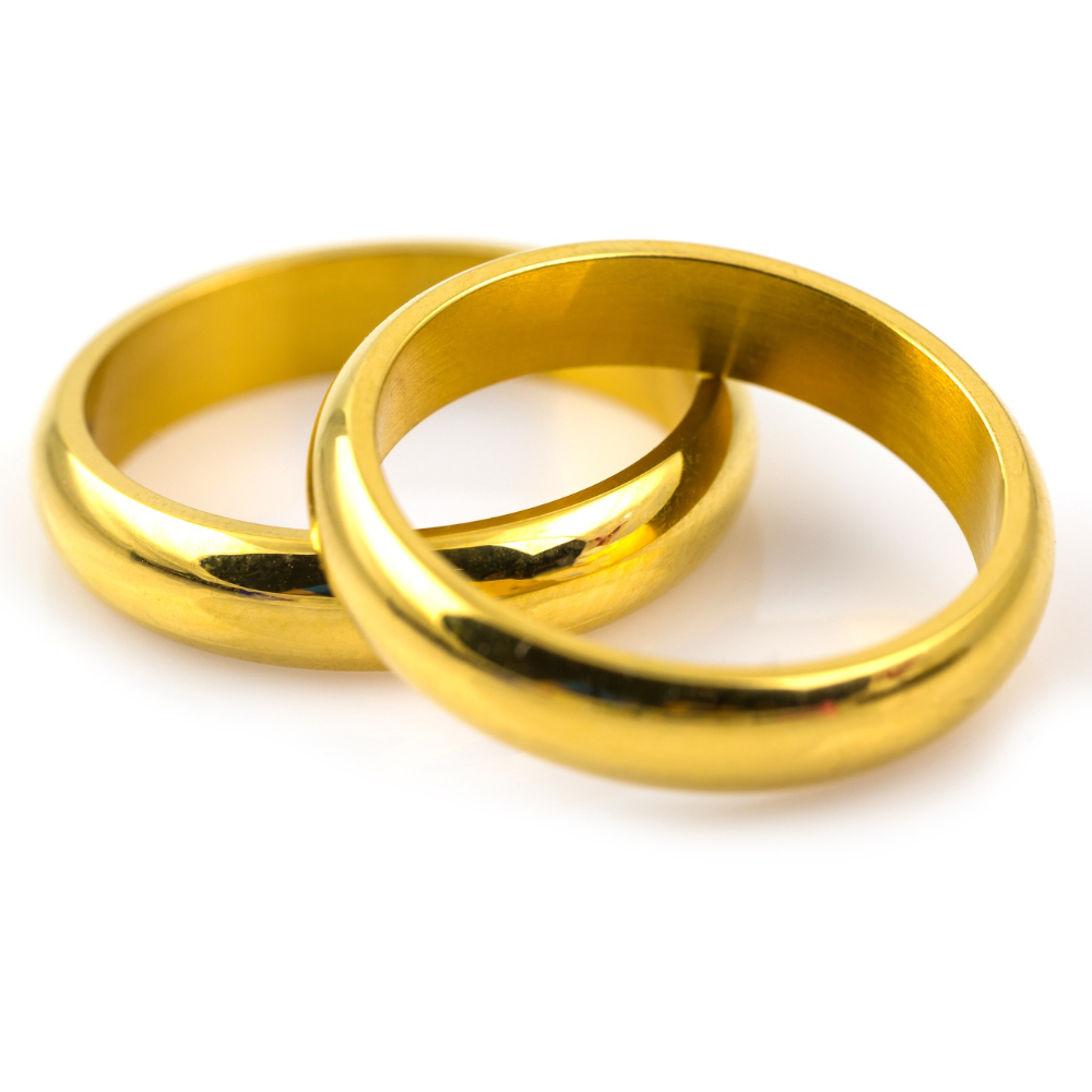Two shiny gold wedding bands overlapping on a white background.